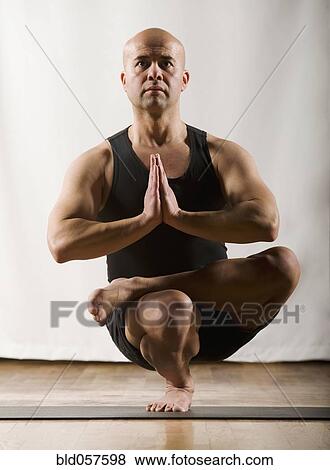 Hispanic man practicing yoga View Large Photo Image Stock Photo - Hispanic man practicing yoga. Fotosearch