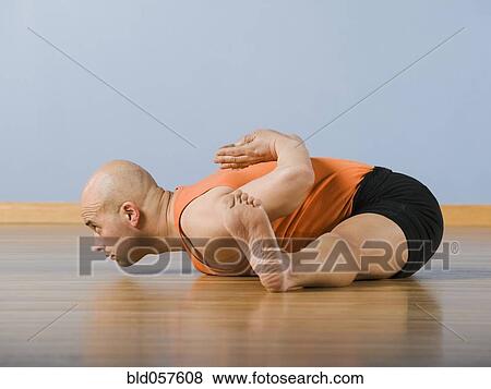Hispanic man practicing yoga View Large Photo Image Stock Photo - Hispanic man practicing yoga. Fotosearch