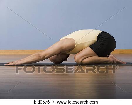 Hispanic man practicing yoga View Large Photo Image Stock Photo - Hispanic man practicing yoga. Fotosearch