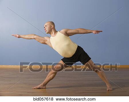 Hispanic man practicing yoga View Large Photo Image Stock Photo - Hispanic man practicing yoga. Fotosearch