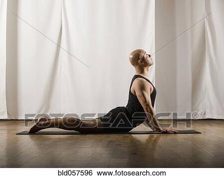 Stock Photograph - Hispanic man practicing yoga. Fotosearch