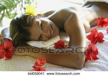 Hispanic woman laying on spa table View Large Photo Image Stock Image - Hispanic woman laying on spa table. Fotosearch