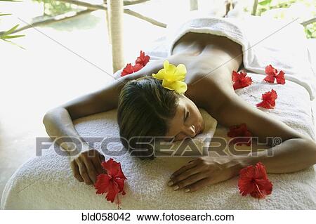 Hispanic woman laying on spa table View Large Photo Image Stock Image - Hispanic woman laying on spa table. Fotosearch
