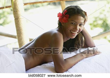 Hispanic woman laying on spa table View Large Photo Image Stock Photo - Hispanic woman laying on spa table. Fotosearch