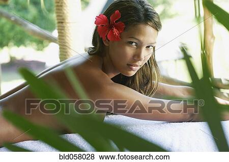 Hispanic woman laying on spa table View Large Photo Image Stock Photo - Hispanic woman laying on spa table. Fotosearch