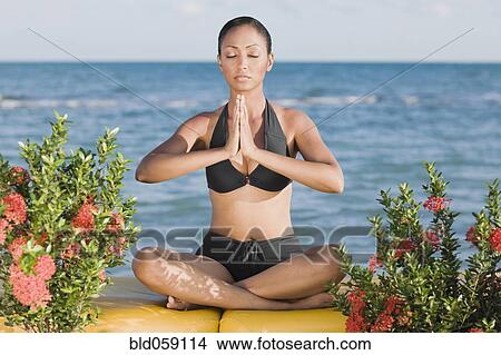 Hispanic woman meditating View Large Photo Image Picture - Hispanic woman meditating. Fotosearch