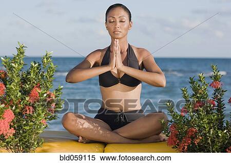 Hispanic woman meditating View Large Photo Image Stock Photography - Hispanic woman meditating. Fotosearch