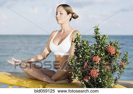 Hispanic woman meditating View Large Photo Image Stock Photography - Hispanic woman meditating. Fotosearch