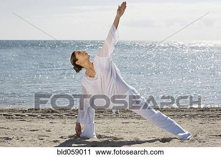 Hispanic woman practicing yoga View Large Photo Image Stock Image - Hispanic woman practicing yoga. Fotosearch