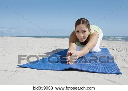 Hispanic woman practicing yoga View Large Photo Image Stock Image - Hispanic woman practicing yoga. Fotosearch