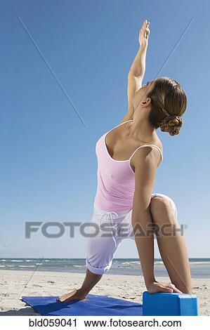 Hispanic woman practicing yoga View Large Photo Image Stock Image - Hispanic woman practicing yoga. Fotosearch