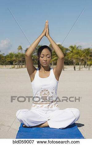 Hispanic woman practicing yoga View Large Photo Image Stock Photo - Hispanic woman practicing yoga. Fotosearch