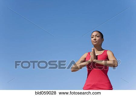 Hispanic woman practicing yoga View Large Photo Image Stock Photo - Hispanic woman practicing yoga. Fotosearch