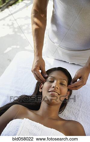Hispanic woman receiving facial massage View Large Photo Image Stock Image - Hispanic woman receiving facial massage. Fotosearch