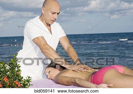 Hispanic woman receiving massage View Large Photo Image Stock Image - Hispanic woman receiving massage. Fotosearch