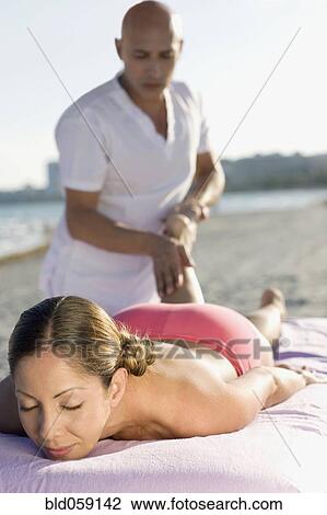Hispanic woman receiving massage View Large Photo Image Stock Image - Hispanic woman receiving massage. Fotosearch