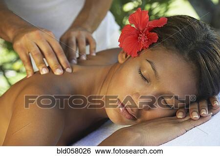 Hispanic woman receiving massage View Large Photo Image Stock Photograph - Hispanic woman receiving massage. Fotosearch