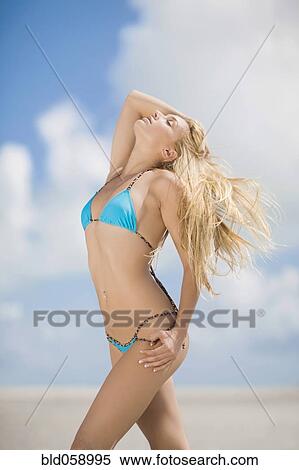 Hispanic woman wearing bikini View Large Photo Image Stock Photography - Hispanic woman wearing bikini. Fotosearch