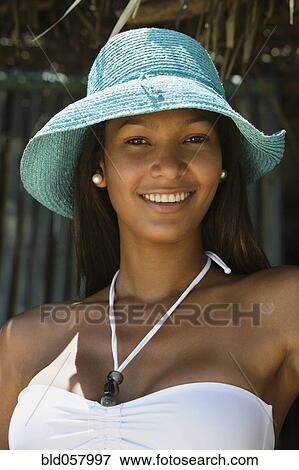 Stock Photo - Hispanic woman wearing straw hat. Fotosearch