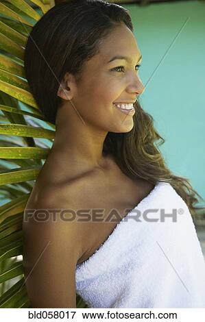 Hispanic woman wrapped in towel View Large Photo Image Stock Photo - Hispanic woman wrapped in towel. Fotosearch