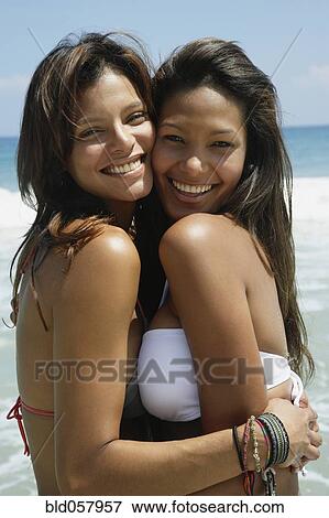 Hispanic women hugging View Large Photo Image Stock Photo - Hispanic women hugging. Fotosearch