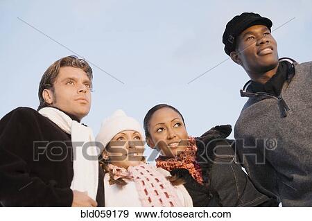 Low angle view of multi-ethnic couples View Large Photo Image Stock Photo - Low angle view of multi-ethnic couples. Fotosearch