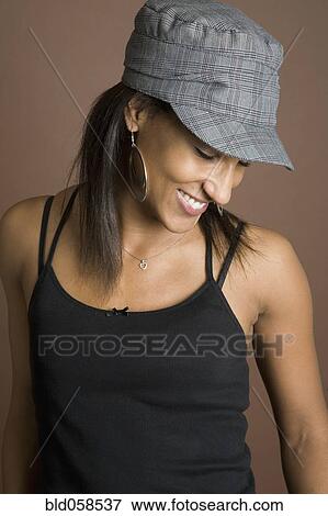 Stock Photo - Mixed Race woman wearing hat. Fotosearch