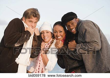 Multi-ethnic couples hugging View Large Photo Image Stock Photo - Multi-ethnic couples hugging. Fotosearch