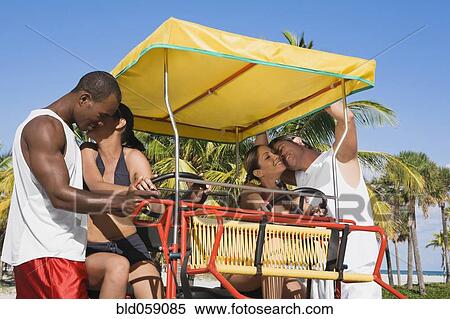 Stock Photography - Multi-ethnic couples hugging. Fotosearch