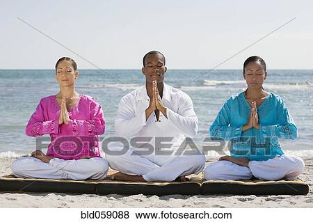 Multi-ethnic friends meditating View Large Photo Image Stock Photo - Multi-ethnic friends meditating. Fotosearch