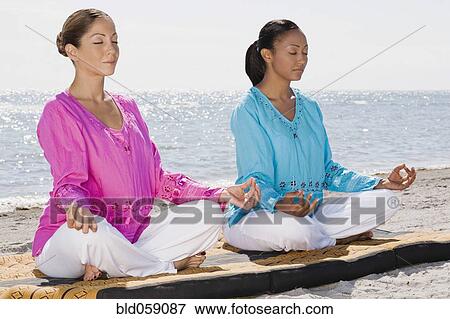 Stock Photo - Multi-ethnic women meditating. Fotosearch