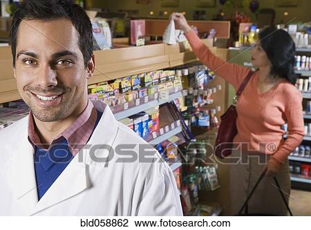 Pacific Islander pharmacist in front of customer View Large Photo Image Stock Image - Pacific Islander pharmacist in front of customer. Fotosearch