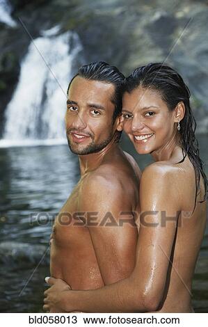 Topless Hispanic couple hugging View Large Photo Image Stock Image - Topless Hispanic couple hugging. Fotosearch