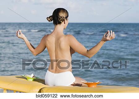 Topless Hispanic woman meditating View Large Photo Image Stock Image - Topless Hispanic woman meditating. Fotosearch