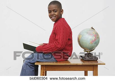 African boy holding book View Large Photo Image Picture - African boy holding book. Fotosearch