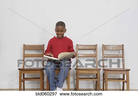 African boy reading book View Large Photo Image Stock Photo - African boy reading book. Fotosearch