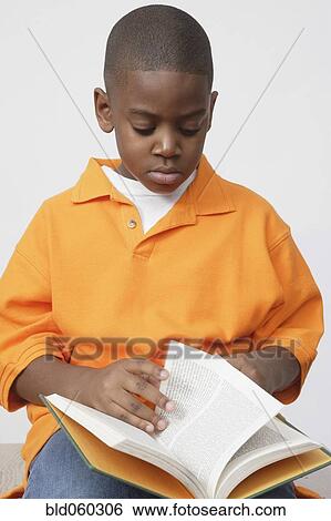 African boy reading book View Large Photo Image Stock Photograph - African boy reading book. Fotosearch