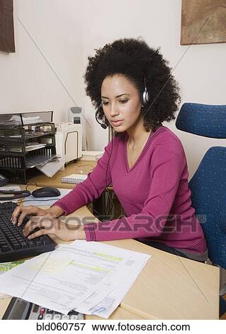African businesswoman typing on computer View Large Photo Image Stock Photo - African businesswoman typing on computer. Fotosearch