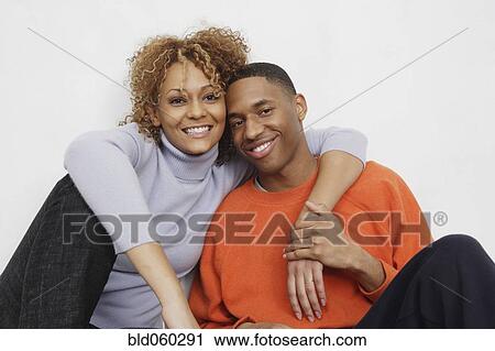 Stock Image - African couple hugging. Fotosearch