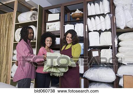 African couple shopping for bedding View Large Photo Image Stock Photo - African couple shopping for bedding. Fotosearch