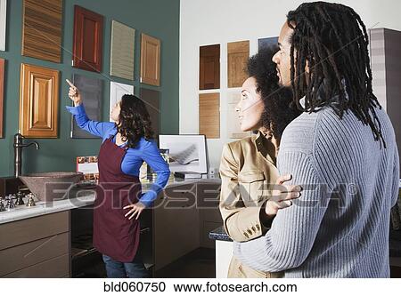 Stock Image - African couple shopping for home decor. Fotosearch