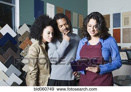 Stock Photo - African couple shopping for home decor. Fotosearch