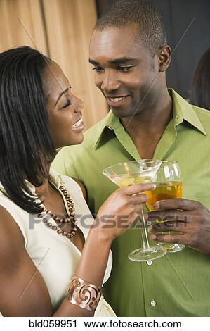 African couple toasting with cocktails View Large Photo Image Stock Image - African couple toasting with cocktails. Fotosearch