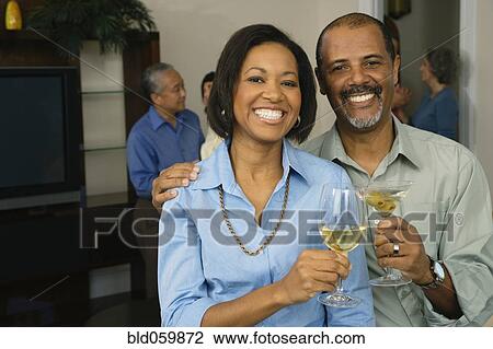 African couple toasting with drinks View Large Photo Image Stock Image - African couple toasting with drinks. Fotosearch