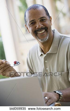 African man eating breakfast View Large Photo Image Stock Photography - African man eating breakfast. Fotosearch