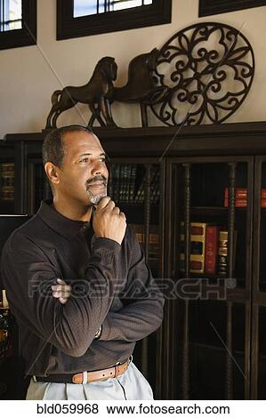 African man thinking with hand on chin View Large Photo Image Stock Photo - African man thinking with hand on chin. Fotosearch
