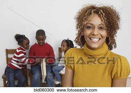 African mother in front of children View Large Photo Image Stock Image - African mother in front of children. Fotosearch