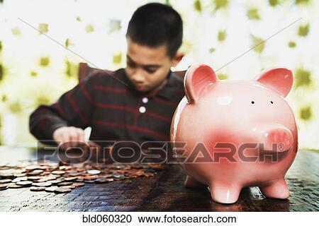 Asian boy counting coins View Large Photo Image Stock Image - Asian boy counting coins. Fotosearch