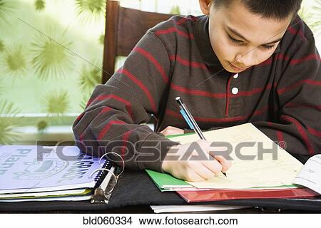 Asian boy doing homework View Large Photo Image Picture - Asian boy doing homework. Fotosearch