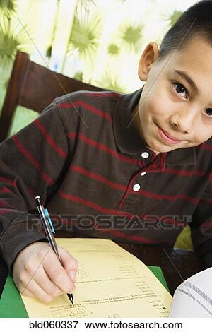 Asian boy doing homework View Large Photo Image Stock Photo - Asian boy doing homework. Fotosearch